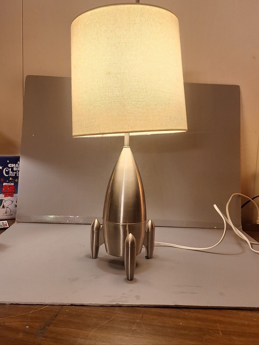 Vintage Style Atomic Rocket Spaceship Lamp is a medium-sized, corded electric.